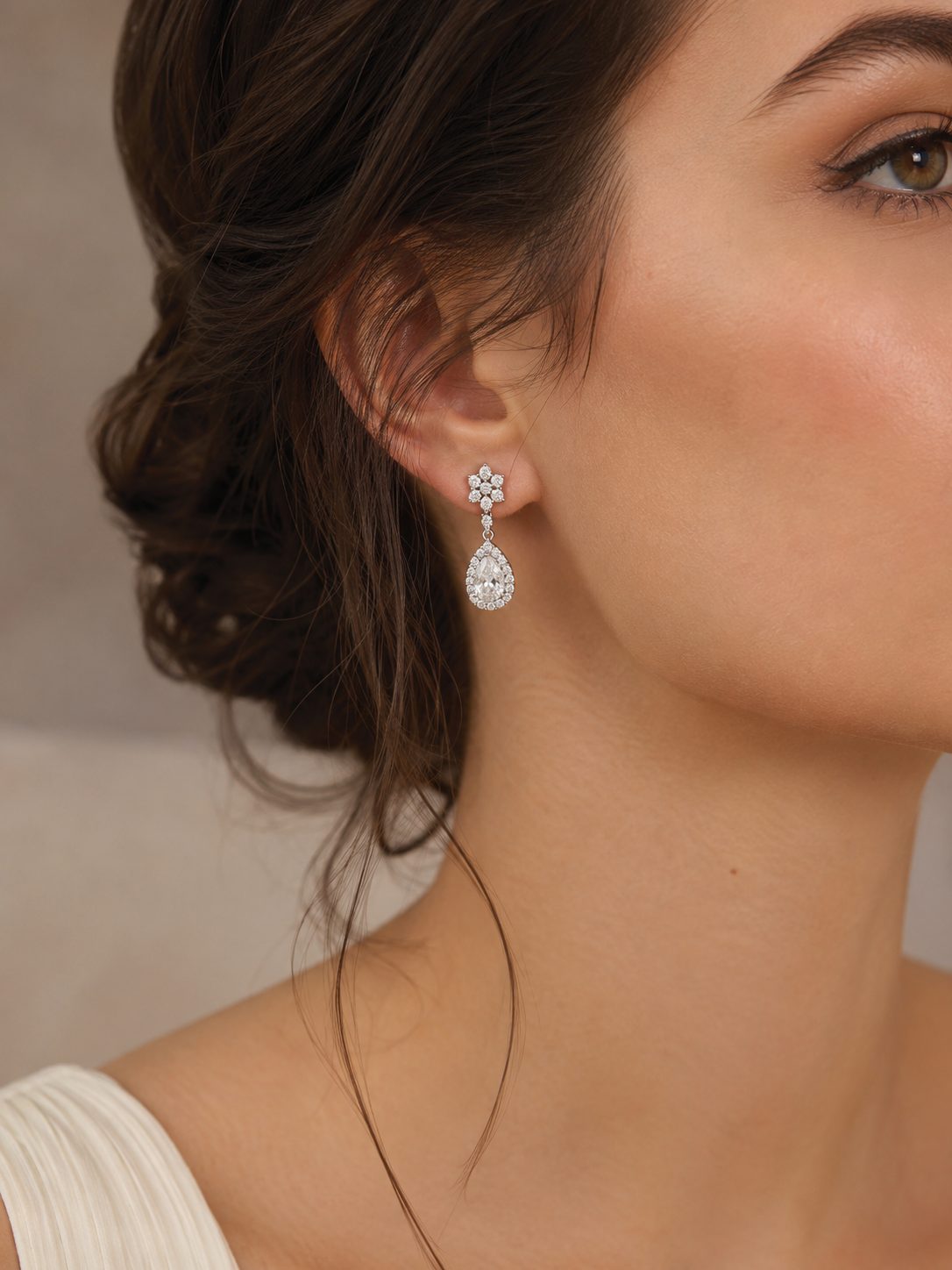 Diamond teardrop earring worn