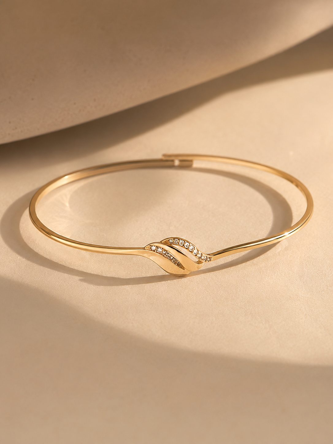 Slim gold bangle with stone detail