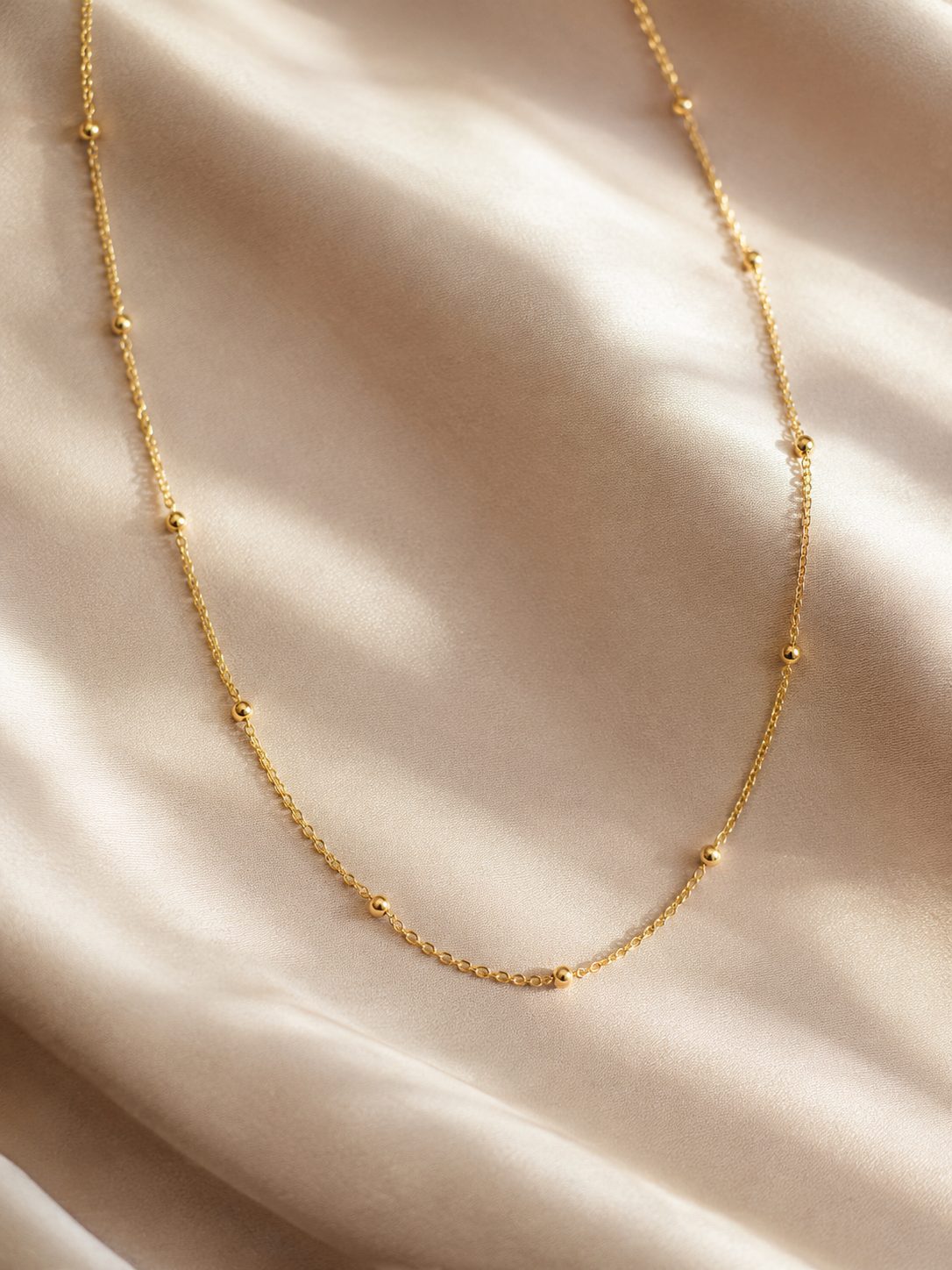 Delicate gold satellite chain