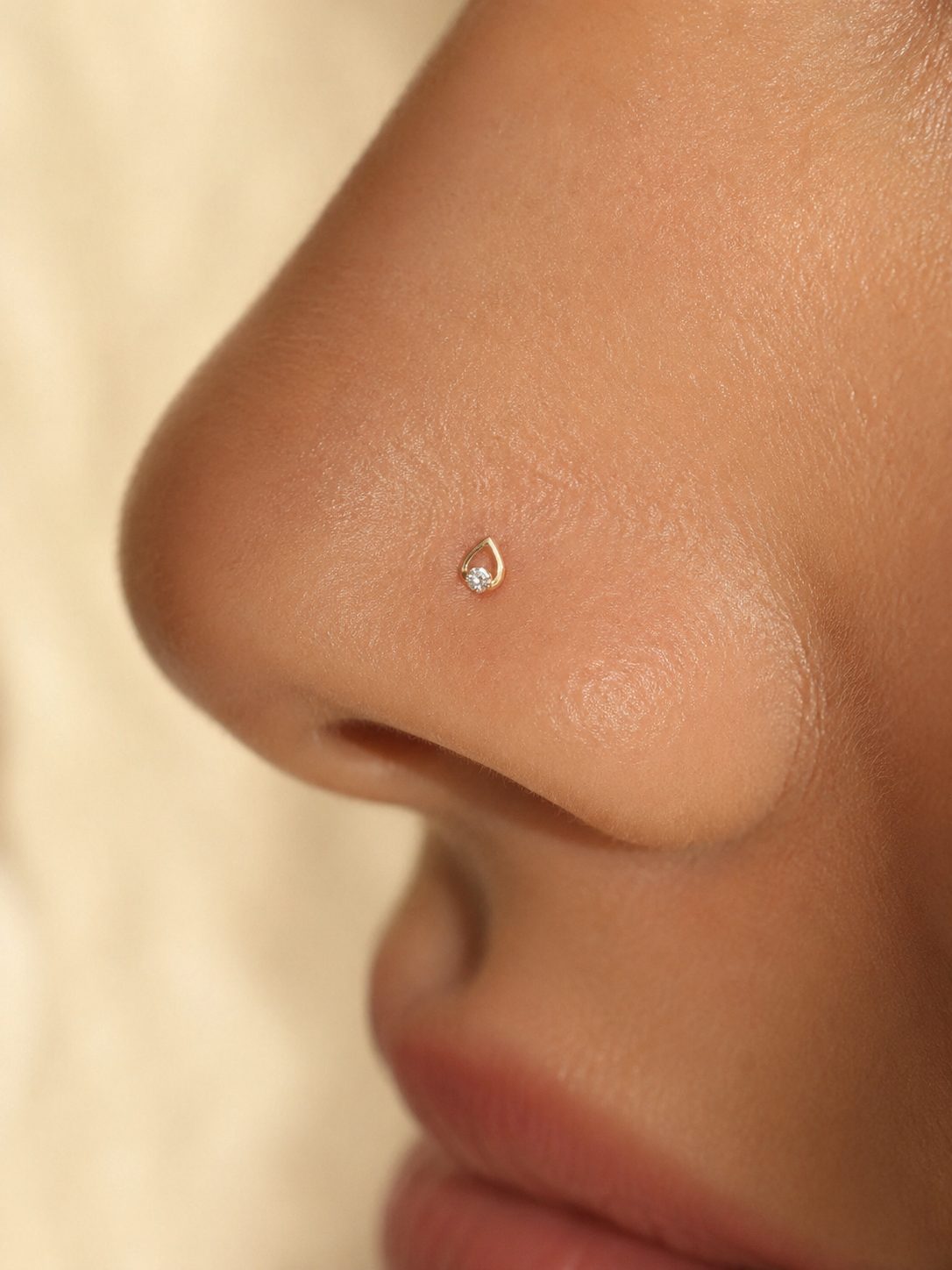 Gold nose pin worn